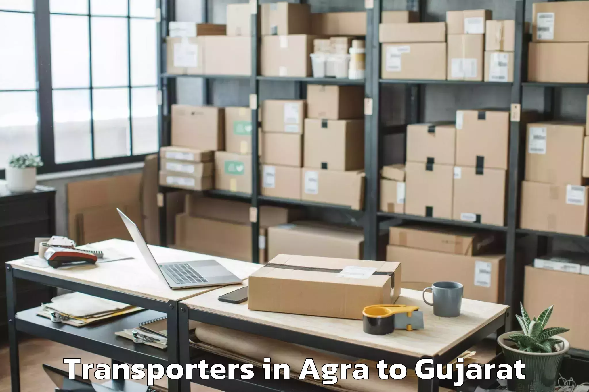 Top Agra to Dhoraji Transporters Available